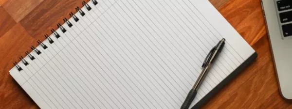 Ruled notebook on desk
