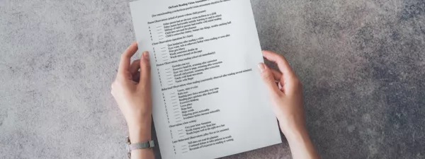 Hands holding the OnTrack Reading Vision Assessment Checklist