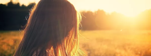 Sun shining on girl's face