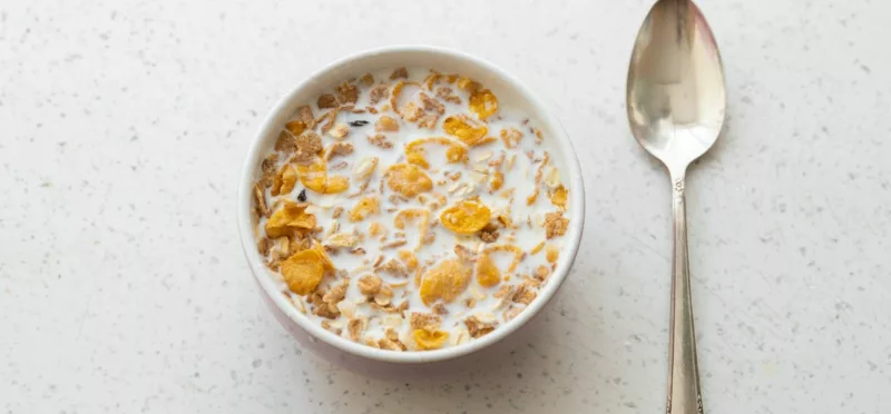 Milk and cereal with spoon